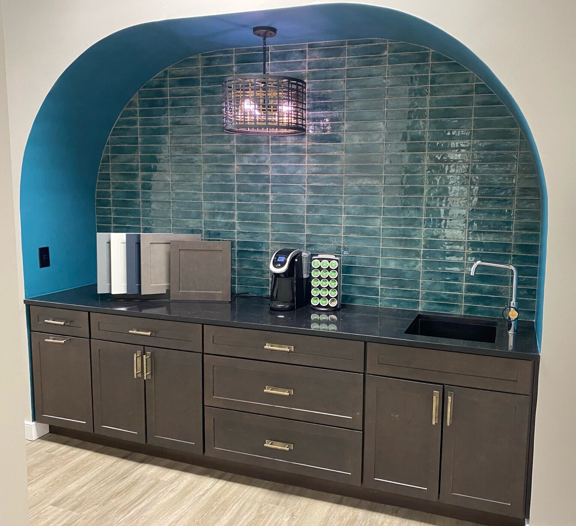 modern wet bar with blue tile backsplash showroom