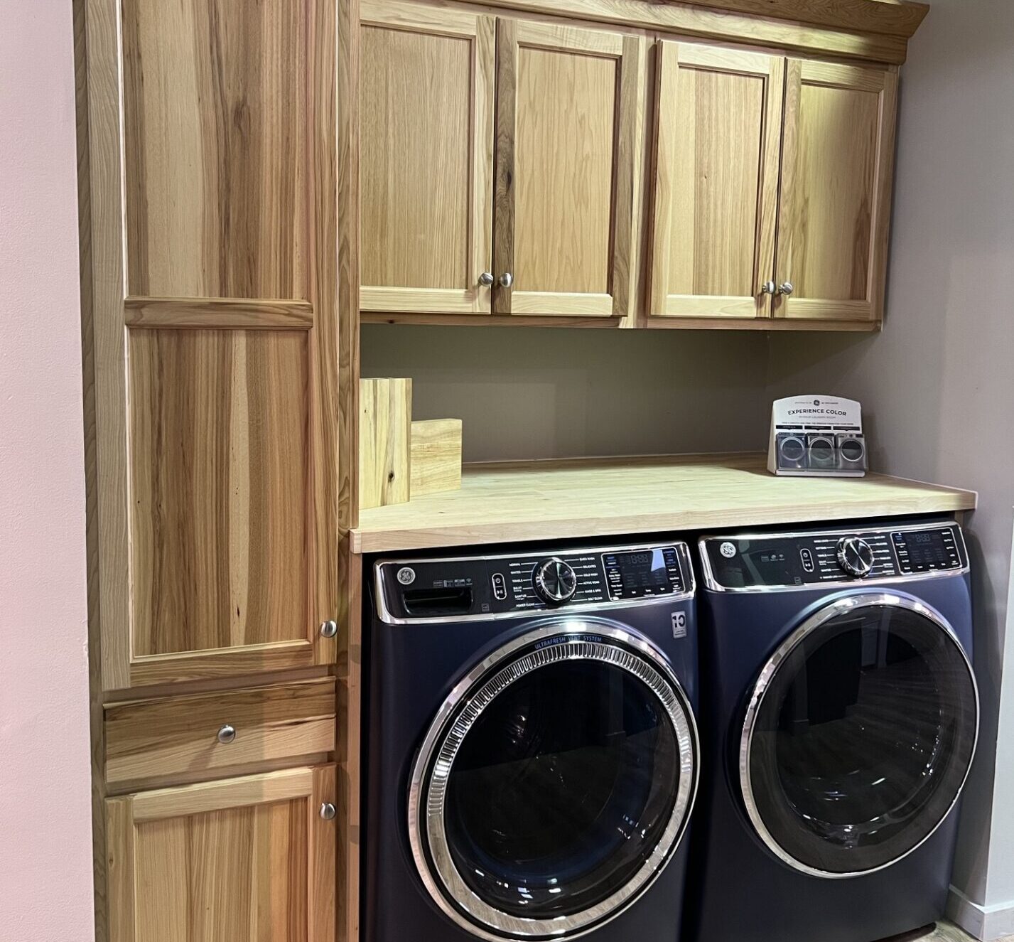 BKT Wilmington De Showroom laundry room with light wood cabinets