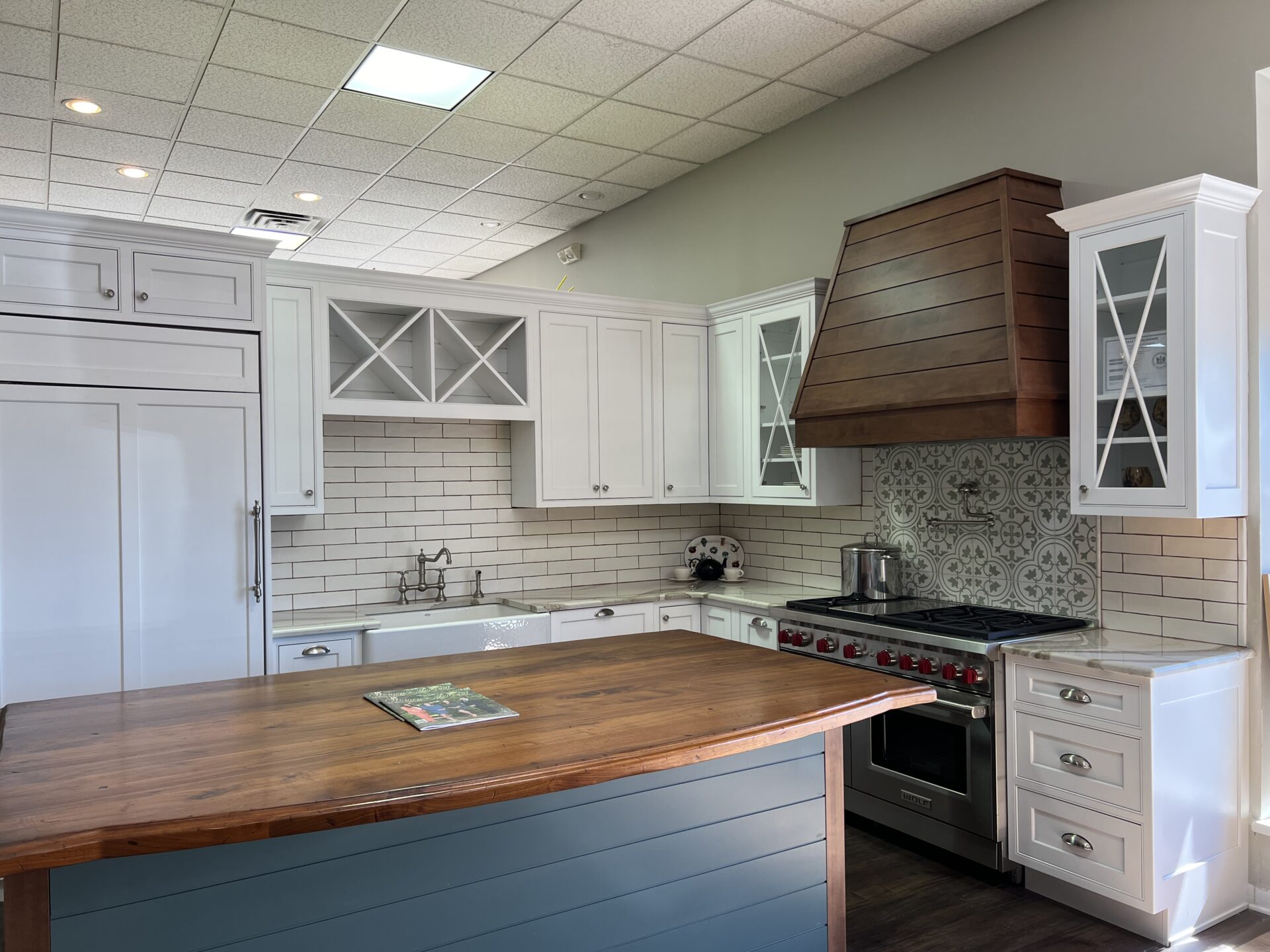 BKT Wilmington De Showroom white kitchen with blue and wooden island